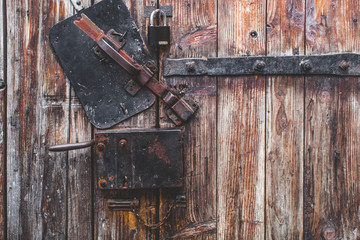 Nice photo about Old door, blacksmith metal latch lock