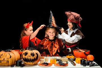 children in halloween costumes with sweets