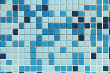 Small tiled square tiles on the pool wall