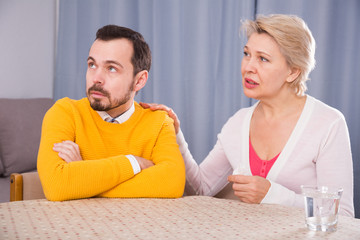 Mature mother and son quarrel