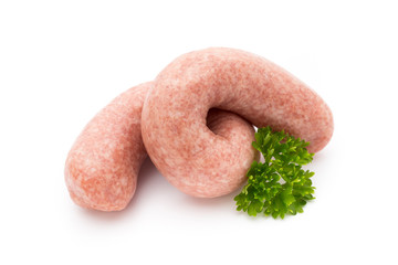 Raw sausages with herbs and spices.