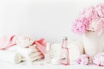 bath and spa with peony flowers beauty products towels