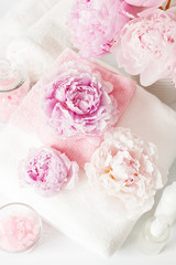 bath and spa with peony flowers beauty products towels