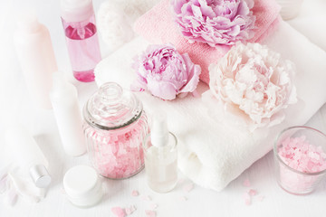 bath and spa with peony flowers beauty products towels
