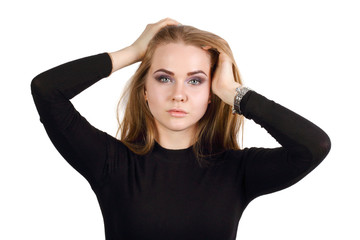 Young blonde in black clothes poses isolated on white background