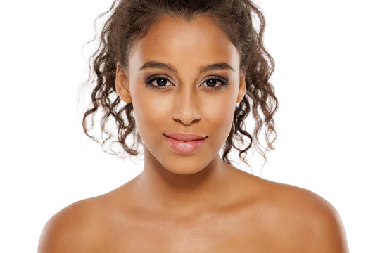 portrait of a young dark-skinned woman on a white background