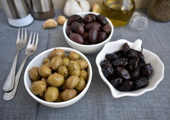 Pickled and dried olives as Mediterranean appetizer.