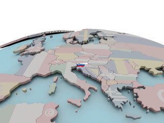 Political map of Slovenia on globe with flag