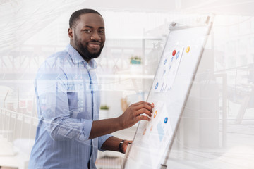 Optimistic African American working with magnet board