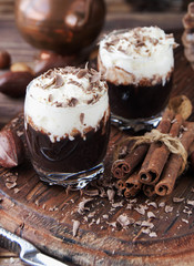 hot chocolate in glass cups and cream with nuts