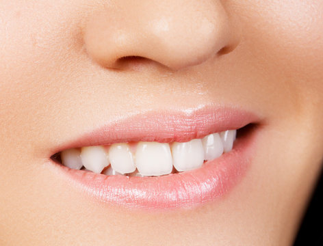 Woman's smile. Healthy white woman's teeth. Dental hygiene, oral care concept. Teeth whitening. Stomatology concept