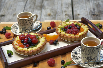 Fresh fruit pie full of raspberry, redcurrant, blackcurrant, kiwi and tea - french dessert