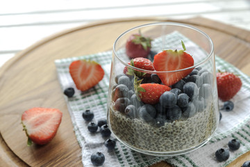 Chia seed pudding with fresh berries, healthy breakfast concept, selective focus