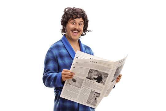 Young man in a blue bathrobe holding a newspaper