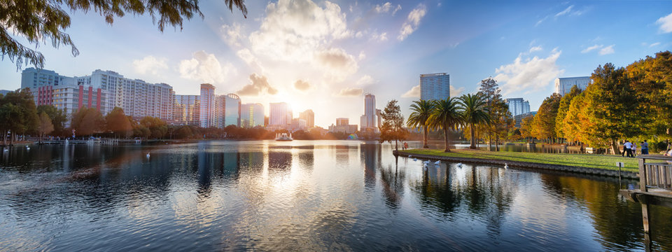 Sunset at Orlando in Lake Eola Park with water fountain and city skyline, Florida, USA