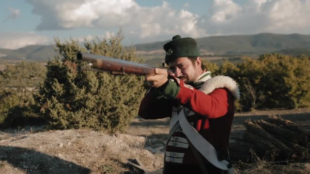 French soldier with the gun aims at the enemy