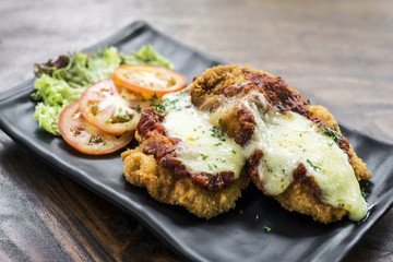 classic  italian chicken parmigiana with cheese and tomato sauce meal