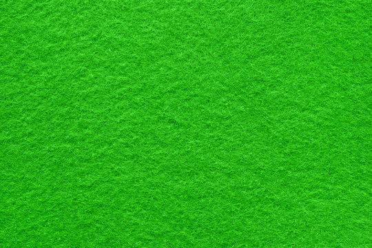 Green felt table surface extremal close up. Large macro texture