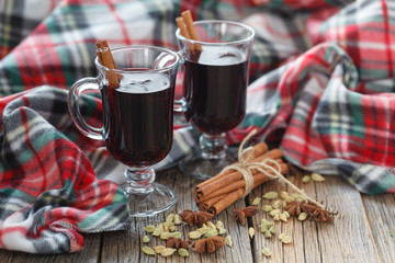 Homemade winter mulled wine with ingredients on table