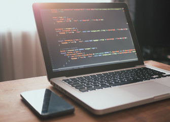 Computer code on laptop (web developing)