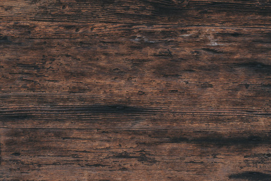 Old Wood background texture of natural wooden boards stained with age. Dark surface with old wooden pattern. Vintage wooden table..