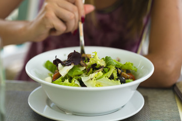 Vegetable salad assorted in a white bowl