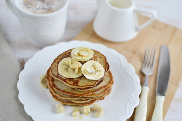 Homemade Banana Cashew Pancakes Honey Sauce Milk Flour Wooden Table Kitchen Towel Cutlery 