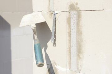 mason's trowel on masonry