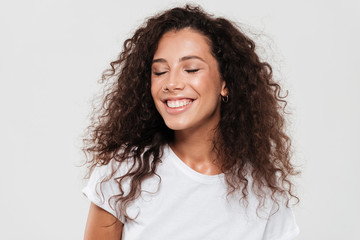 Portrait of a smiling young girl with long curly hair