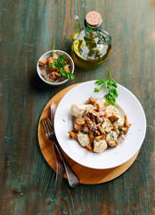 Close up of bread dumplings with chanterelles in cream