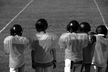 American Football Players on sidelines
