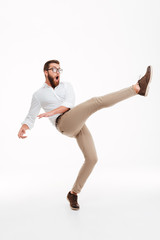 Handsome young bearded man jumping