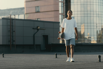 man walking with skateboard