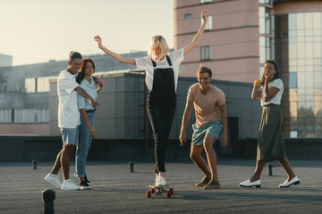 girl riding skateboard on roof