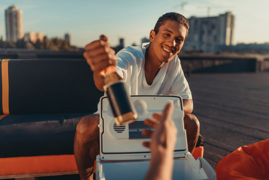 Man Giving Beer At Camera