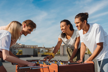 friends playing table football