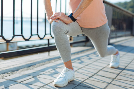Close up of woman doing lunges on the bridge