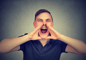 portrait of young angry man screaming