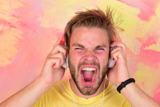 American handsome bearded guy with headphones.