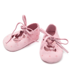 Baby booties on white background