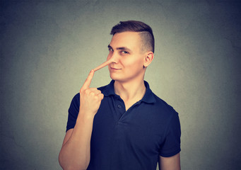 Fototapeta premium Sly man with long nose. Liar concept.