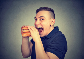 Man eating craving a tasty burger