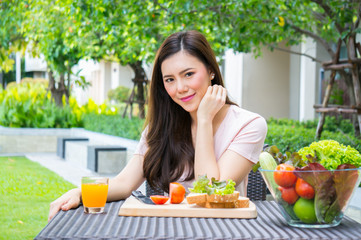 Fototapeta na wymiar Asian beauty woman eat vegetable for health