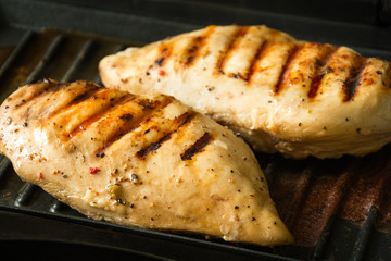 Chicken breasts on a grill. Selective focus
