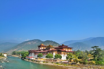Fototapeta na wymiar Punakha Dzong Monastery or Pungthang Dewachen Phodrang (Palace of Great Happiness) and Mo Chhu river in Punakha, the old capital of Bhutan.