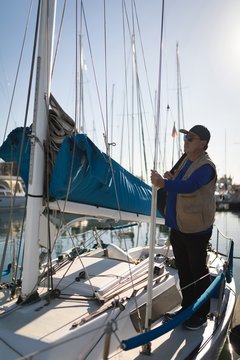 Yachtsman standing on the boat 