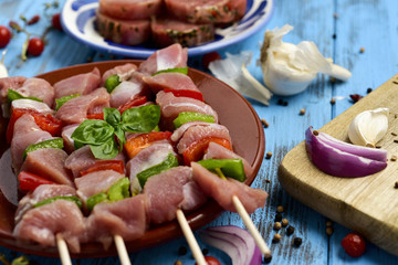 raw turkey meat and vegetables skewers