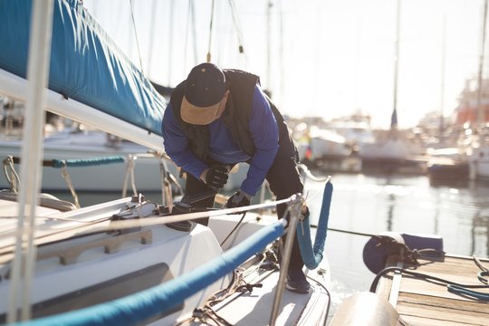 Man pulling winch rope