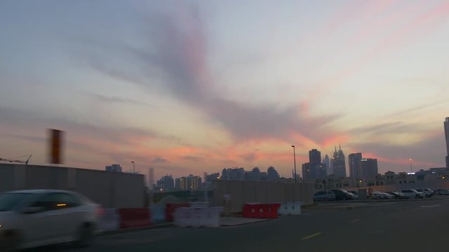 sunset sky dubai city al barsha traffic street pov car driving panorama 4k uae
