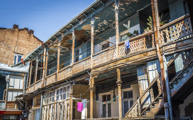 The patio of an old wooden apartment house.